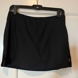 Black Athletic skirt with attached shorts.